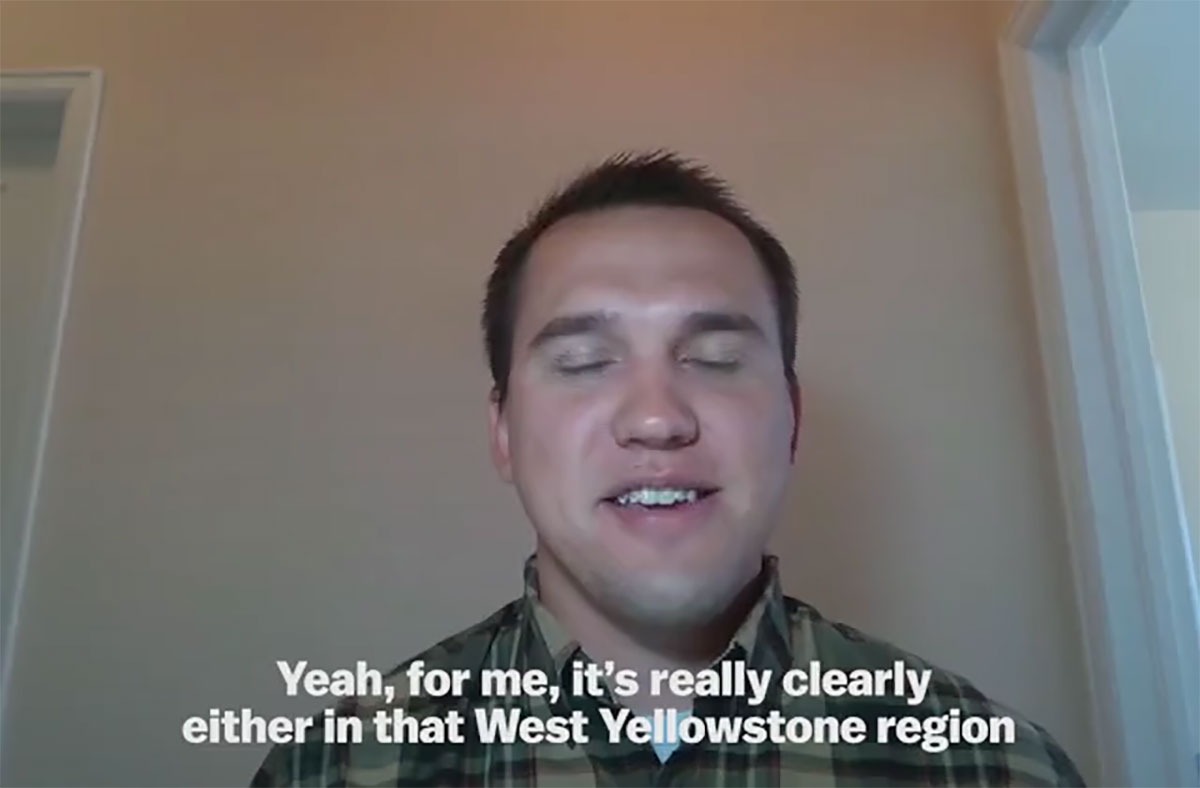 Zach walks across a brige over a roaring river